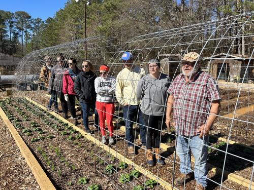 Caged volunteers & Henning.jpg