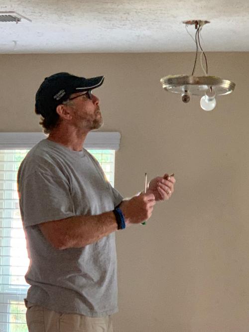 Gene fixing the light.jpeg